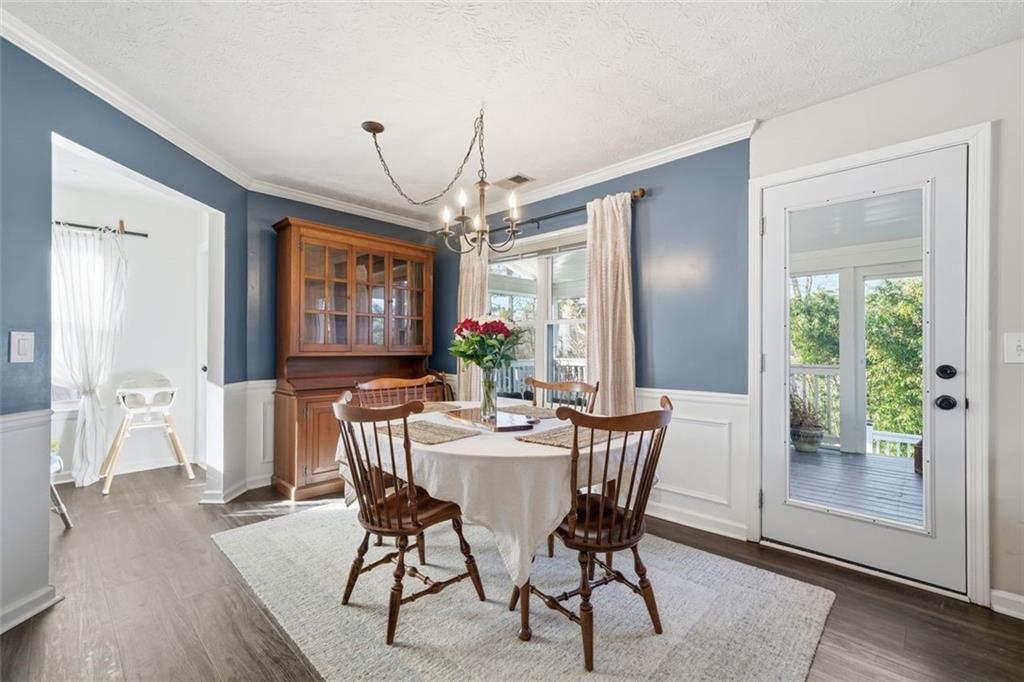 3295 Dundee Ridge Way Duluth, GA 30096 - Photo 8 of 34 a view of a dining room with furniture window and wooden floor