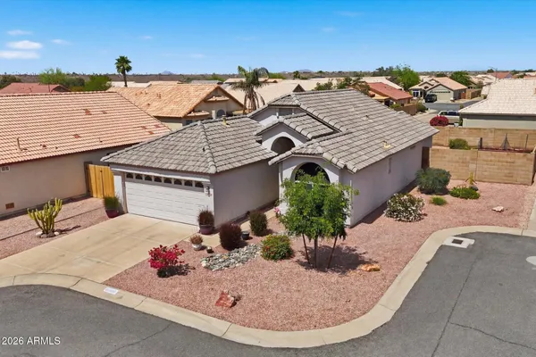 an aerial view of a house with a swimming pool