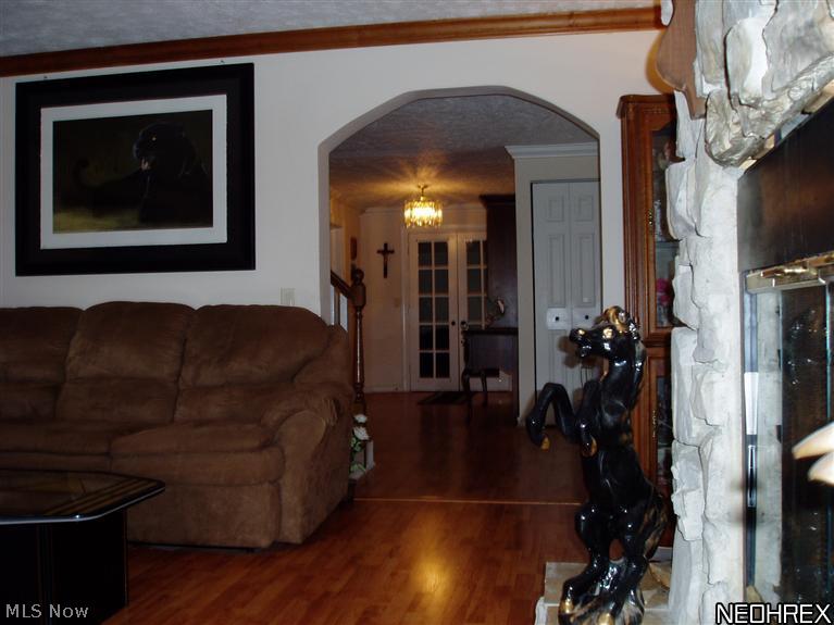 3877 South Ridge Road Perry, OH 44081 - Photo 7 of 25 This light-filled room opens off of the center foyer and leads to the game room (beyond the French Doors) and the formal dining room.