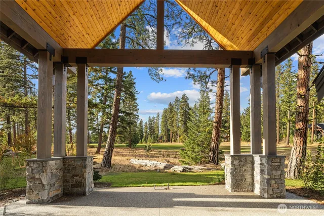 a view of a house with a window and a tree