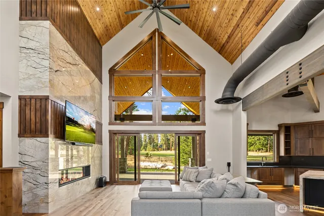 a living room with a couch and windows