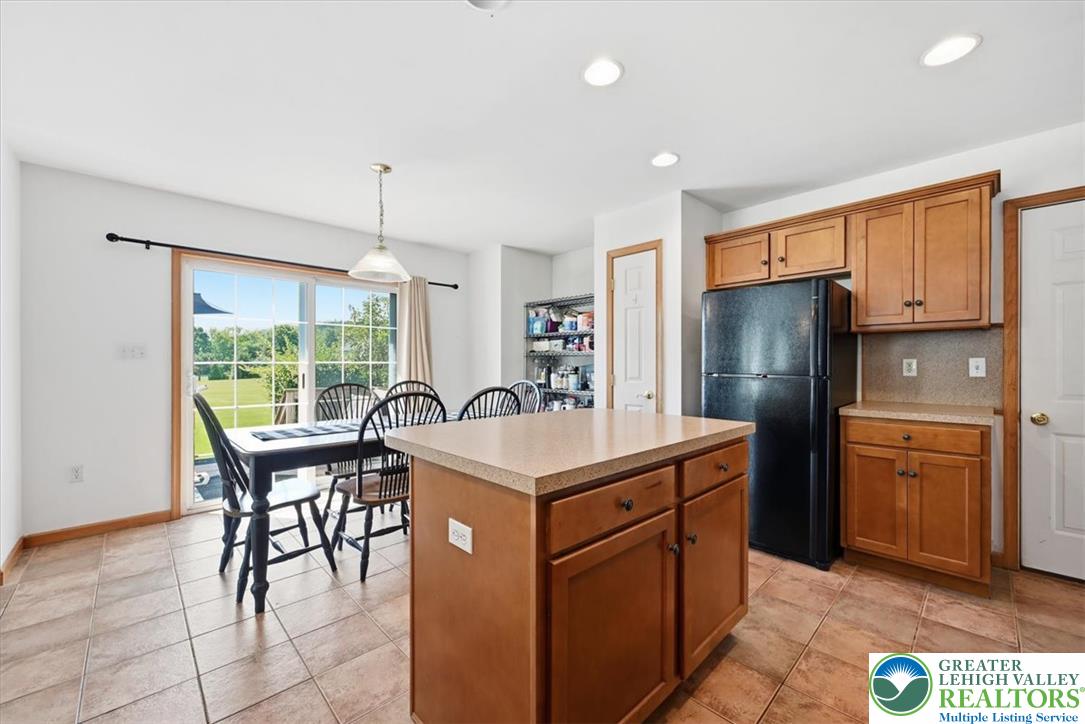 66 Labar Road Bangor, PA 18013 - Photo 12 of 56 A well-appointed kitchen and dining area features warm cabinetry and direct outdoor access.