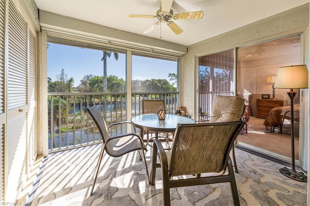 5515 Rattlesnake Hamm Road, Unit 301 Naples, FL 34113 - Photo 4 of 31 Screened-Lanai with Electric Hurricane Shutters. Beautiful Southern View of Lake & Golf Course