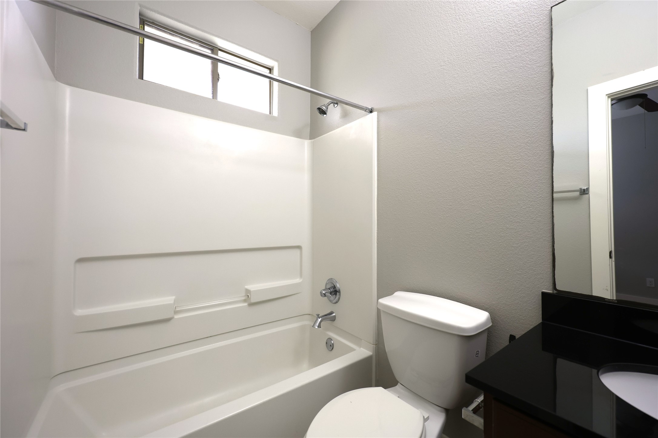 13420 Lyndhurst Street, Unit 304 Austin, TX 78717 - Photo 12 of 17 a bathroom with a toilet a sink and a shower