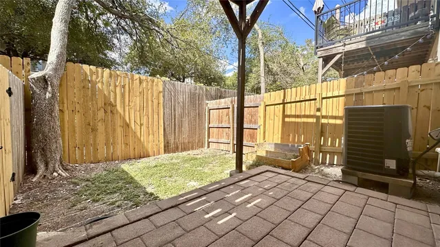 a view of backyard with tub