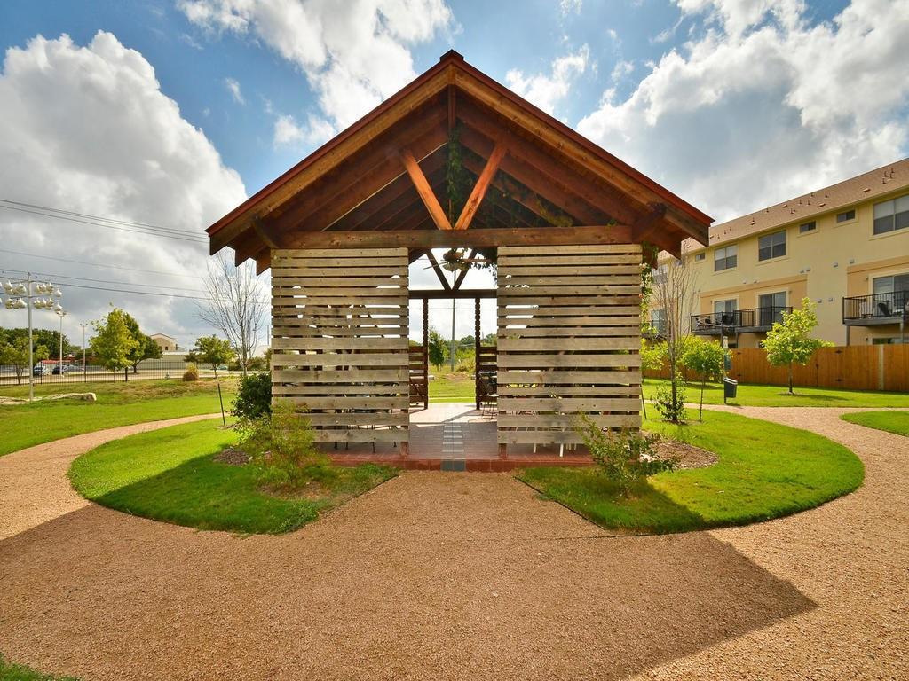 13420 Lyndhurst Street, Unit 304 Austin, TX 78717 - Photo 17 of 17 a view of a house with a yard