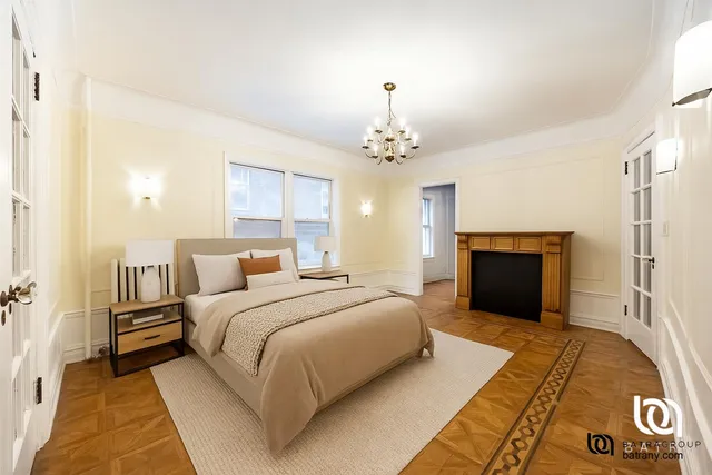 a spacious bedroom with a bed and a chandelier