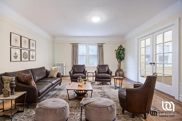 a living room with furniture and a window