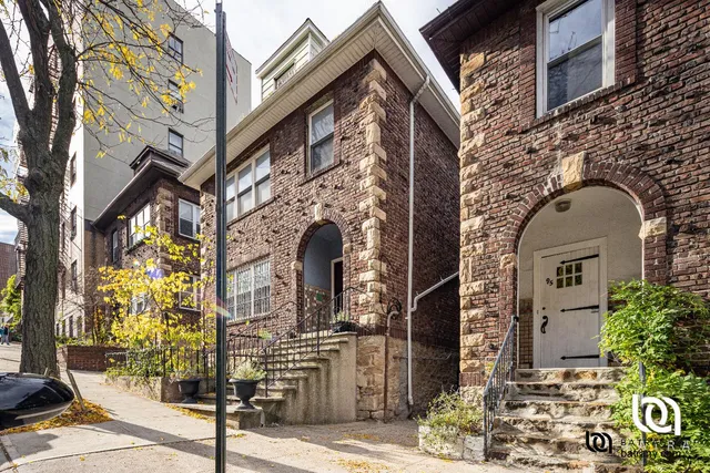 a front view of a building with street view