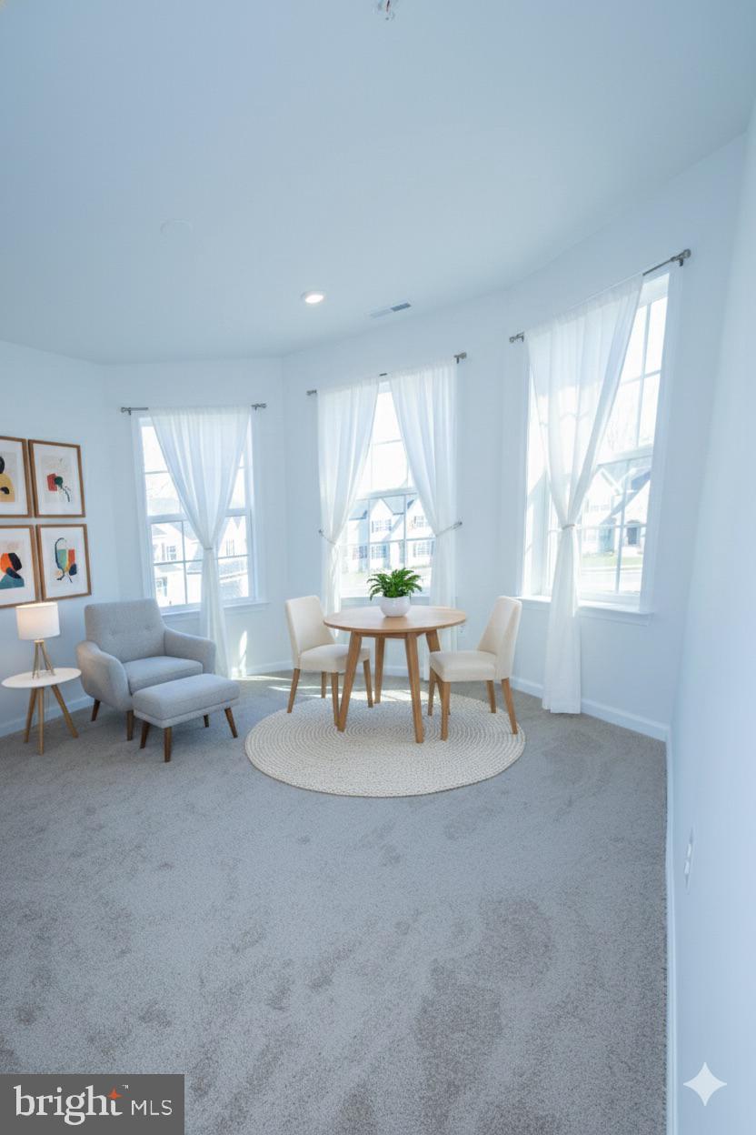 1817 Colt Lane Frederick, MD 21702 - Photo 12 of 43 a living room with furniture and a large window
