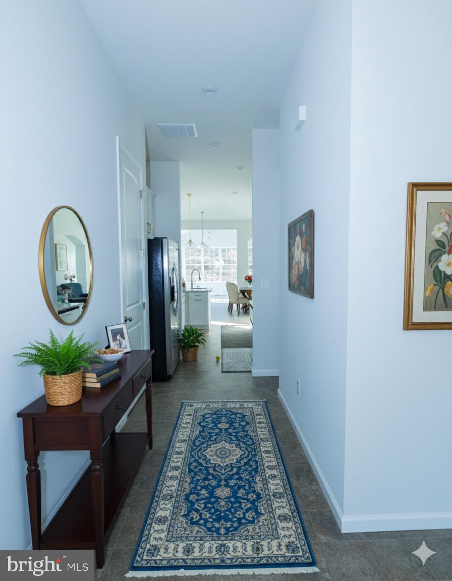 1817 Colt Lane Frederick, MD 21702 - Photo 15 of 43 a living room with a couch a rug kitchen view and a window