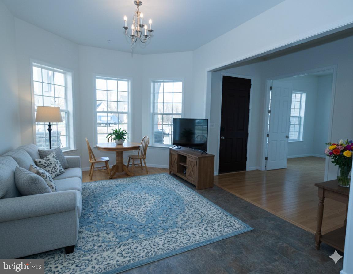 1817 Colt Lane Frederick, MD 21702 - Photo 16 of 43 a living room with furniture and a flat screen tv