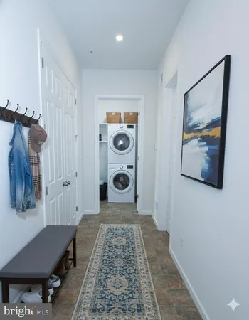 a view of a hallway with a book and a rug