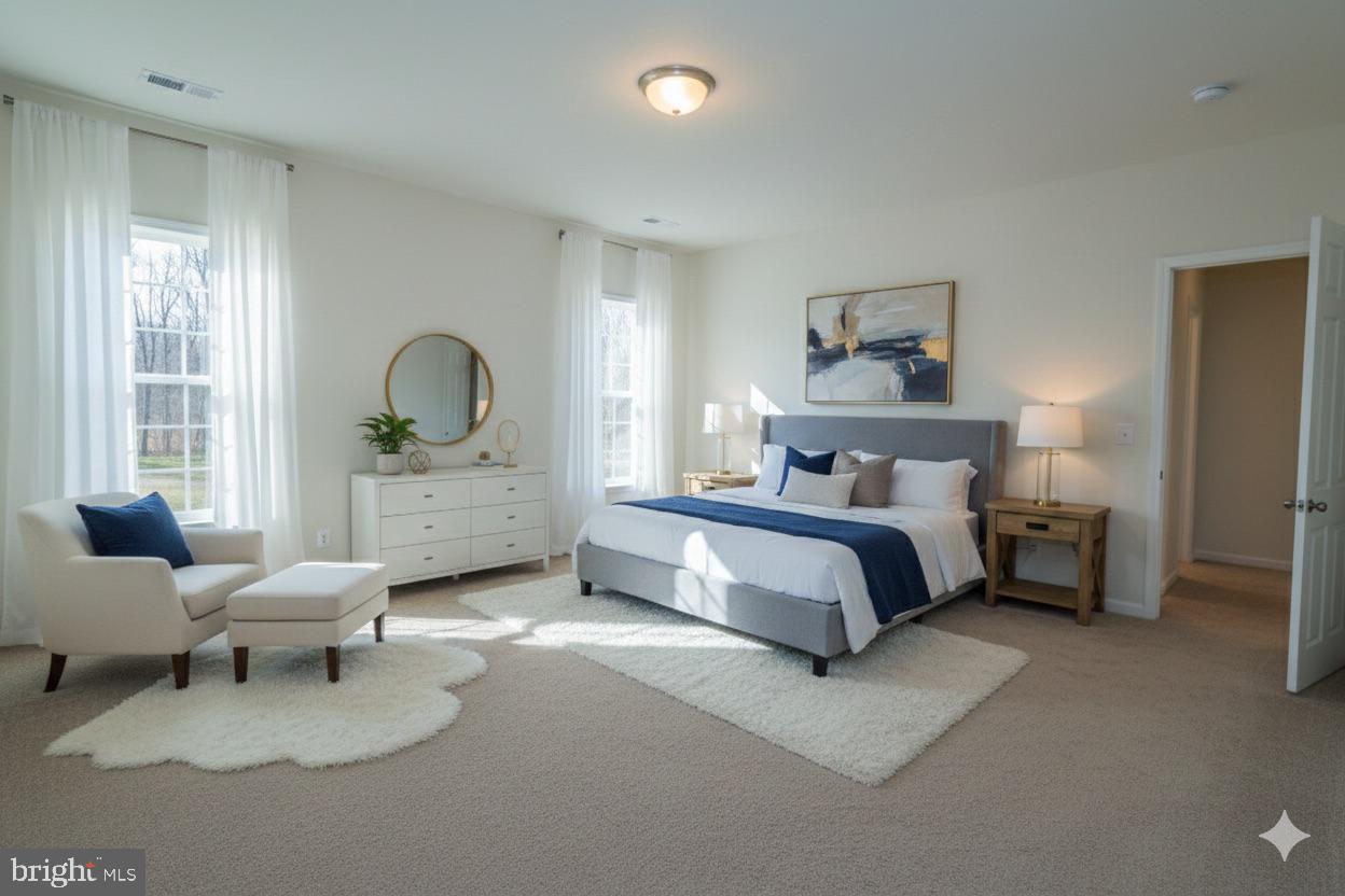 1817 Colt Lane Frederick, MD 21702 - Photo 22 of 43 a spacious bedroom with a bed and a couch