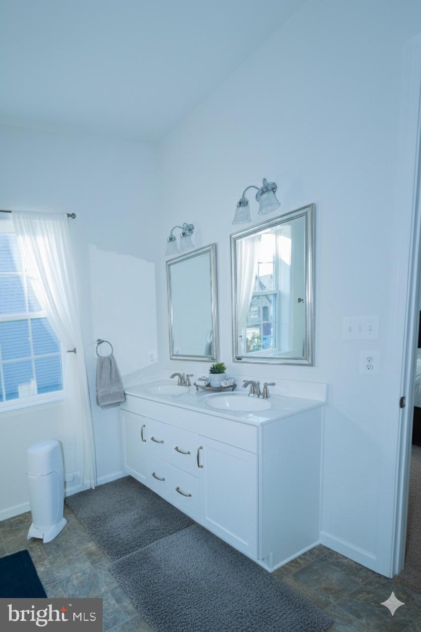 1817 Colt Lane Frederick, MD 21702 - Photo 27 of 43 a bathroom with a sink toilet and mirror