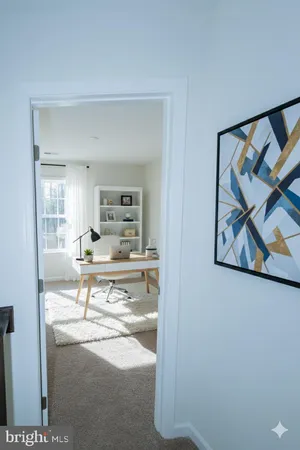a view of living room with furniture and wooden floor
