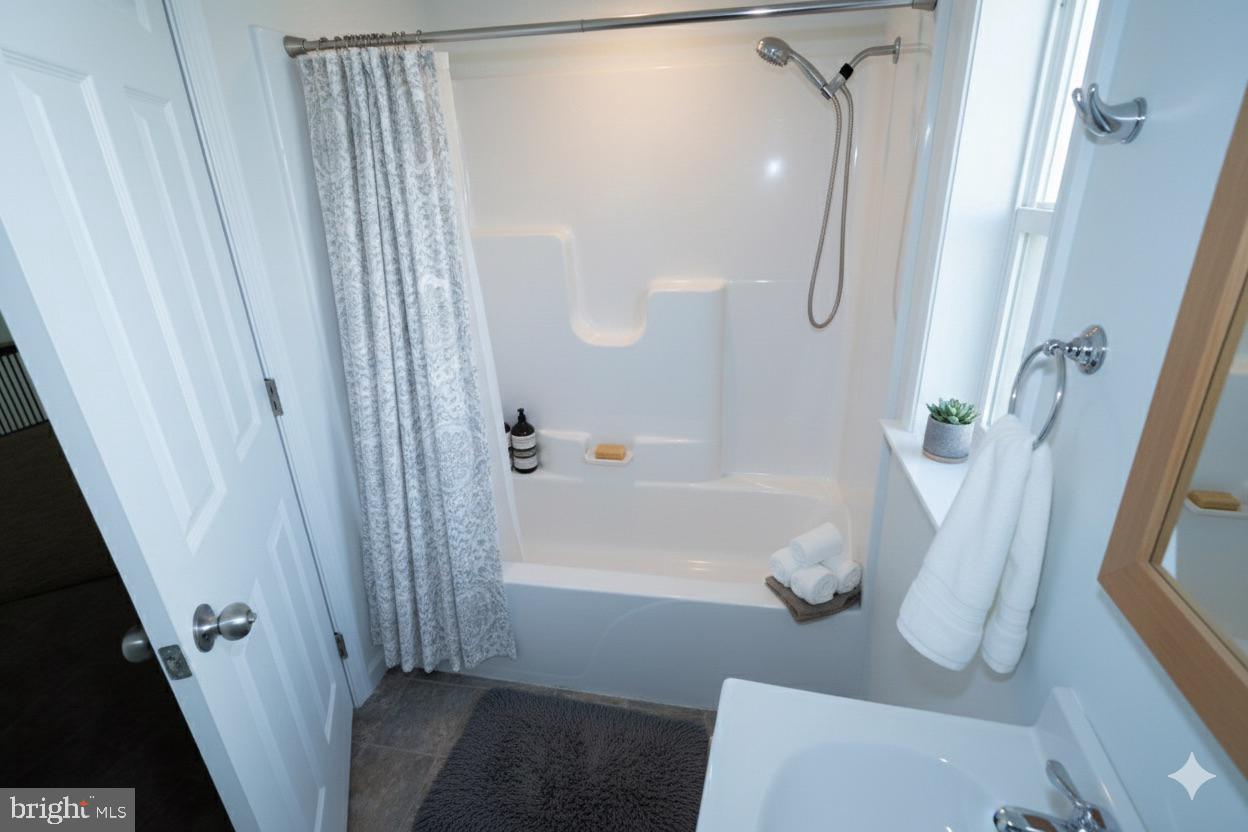 1817 Colt Lane Frederick, MD 21702 - Photo 37 of 43 a bathroom with a shower and a tub