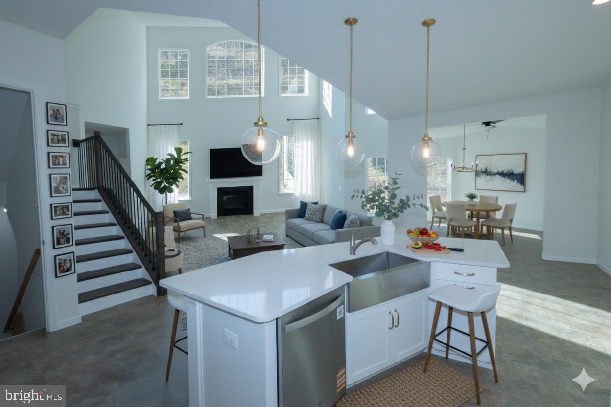 1817 Colt Lane Frederick, MD 21702 - Photo 7 of 43 a living room with furniture a fireplace and wooden floor