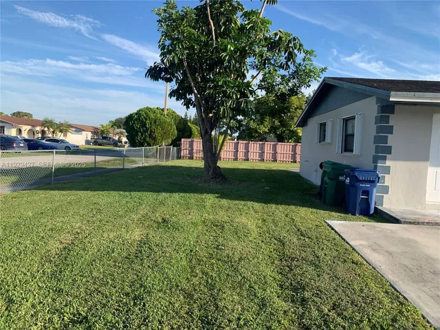 a view of backyard with a garden and entertaining space
