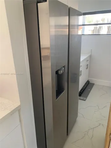 a bathroom with a shower and a mirror