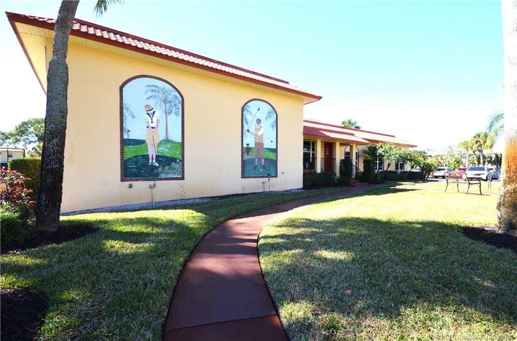 1963 Southwest Palm City Road, Unit F Stuart, FL 34994 - Photo 16 of 19 a front view of house with yard