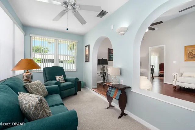 a living room with furniture and a window