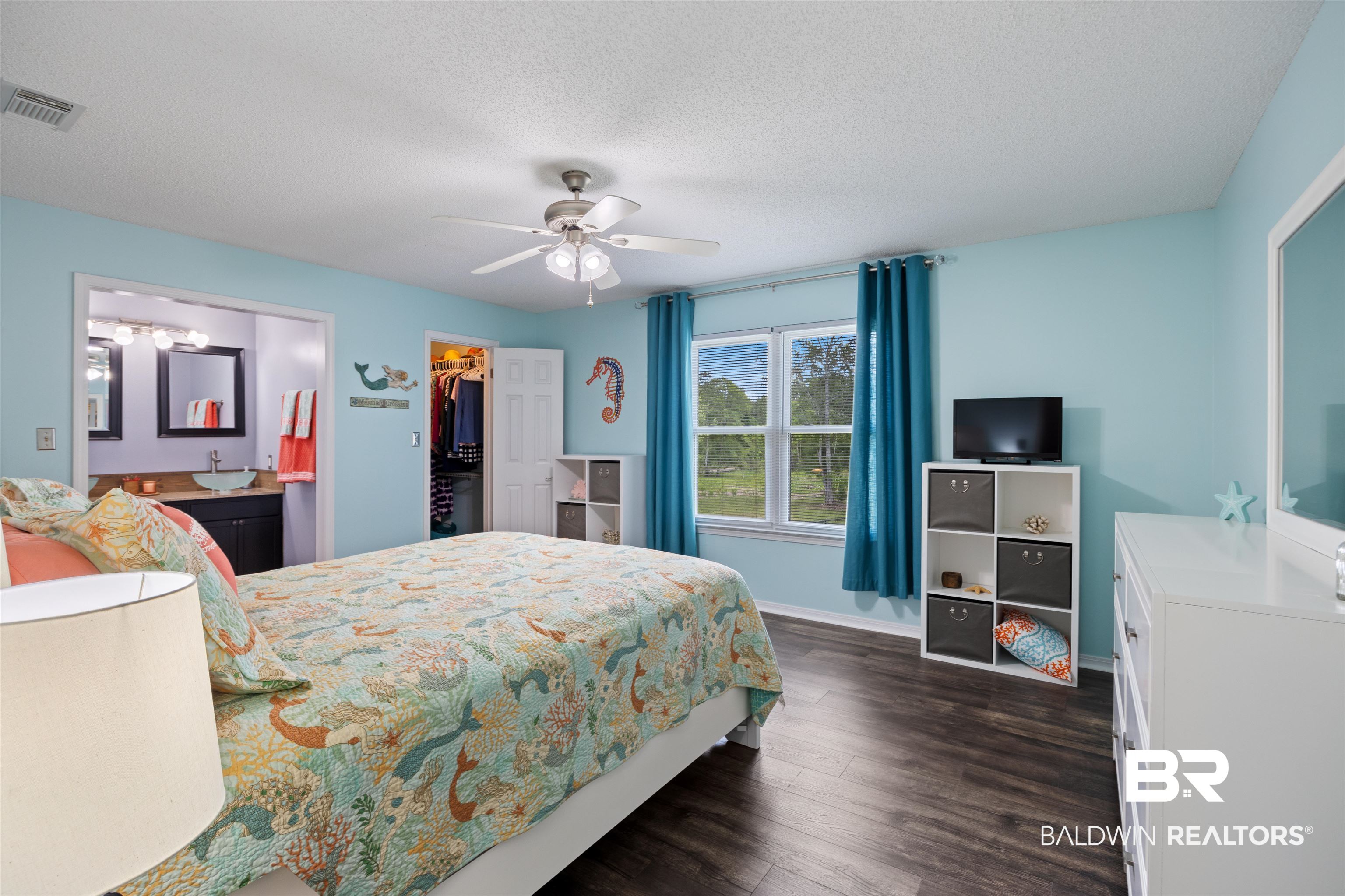 9771 Clarke Ridge Road Foley, AL 36535 - Photo 48 of 72 Bedroom with a closet, a textured ceiling, and a walk-in closet.