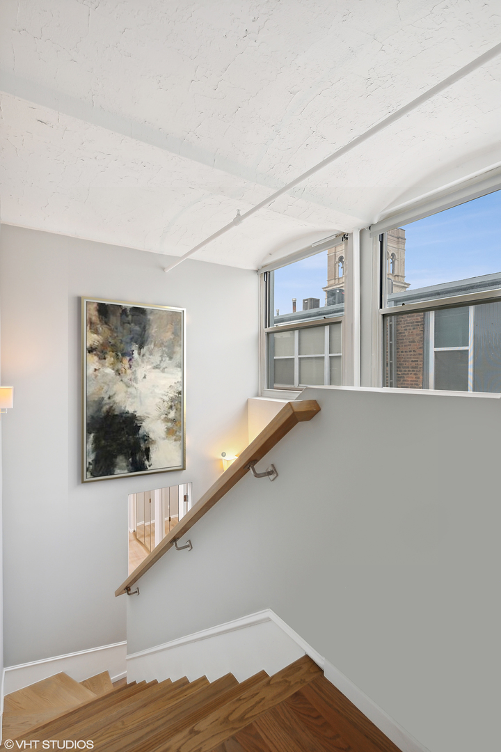 1000 West Washington Boulevard, Unit 513 Chicago, IL 60607 - Photo 12 of 22 a view of a livingroom with furniture and staircase