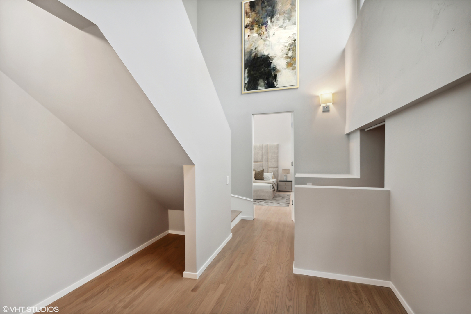 1000 West Washington Boulevard, Unit 513 Chicago, IL 60607 - Photo 13 of 22 a view of a hallway with wooden floor and staircase