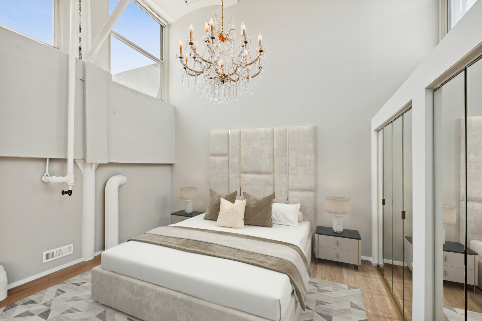 1000 West Washington Boulevard, Unit 513 Chicago, IL 60607 - Photo 15 of 22 a bedroom with a bed and a chandelier