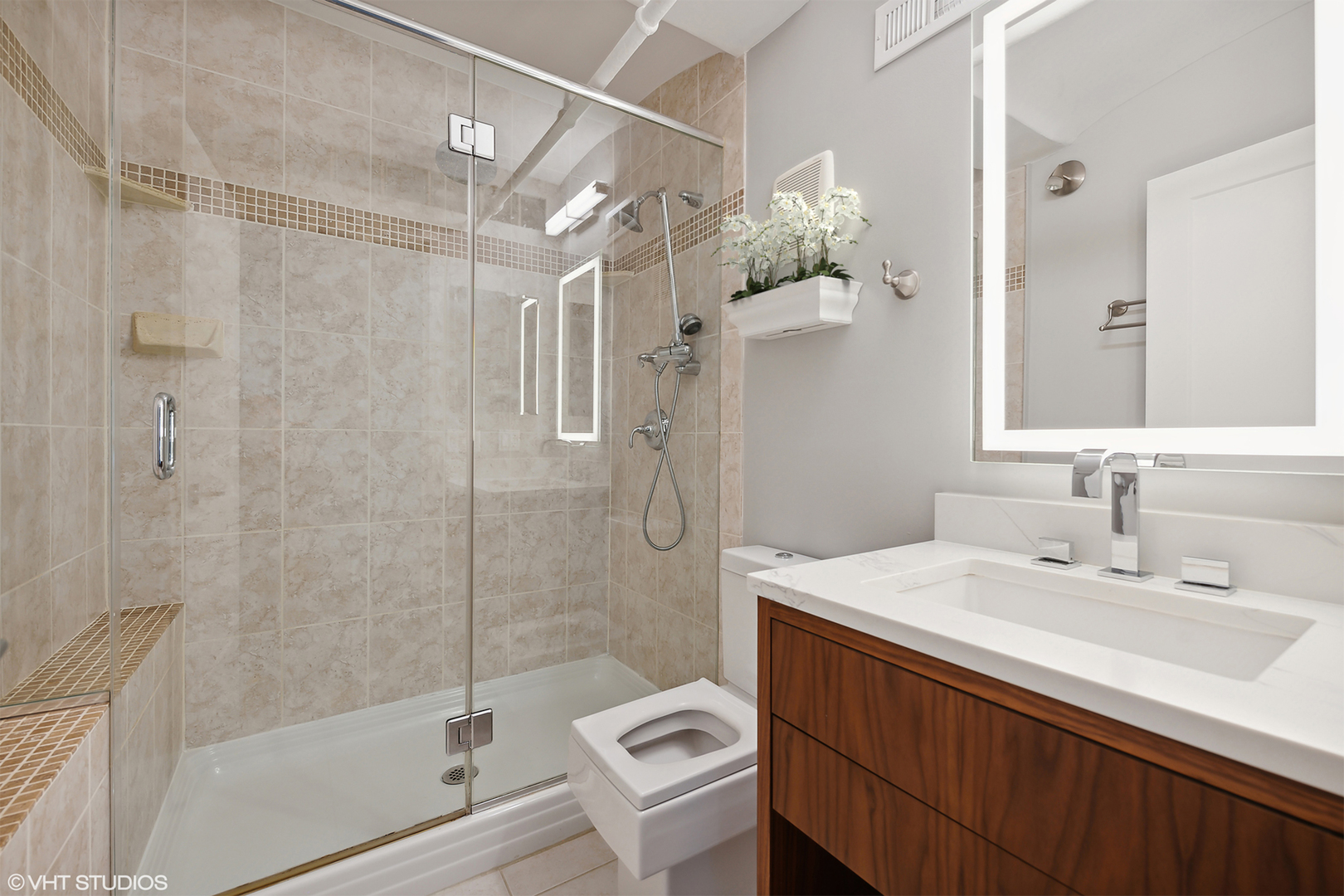 1000 West Washington Boulevard, Unit 513 Chicago, IL 60607 - Photo 17 of 22 a bathroom with a sink a toilet and shower