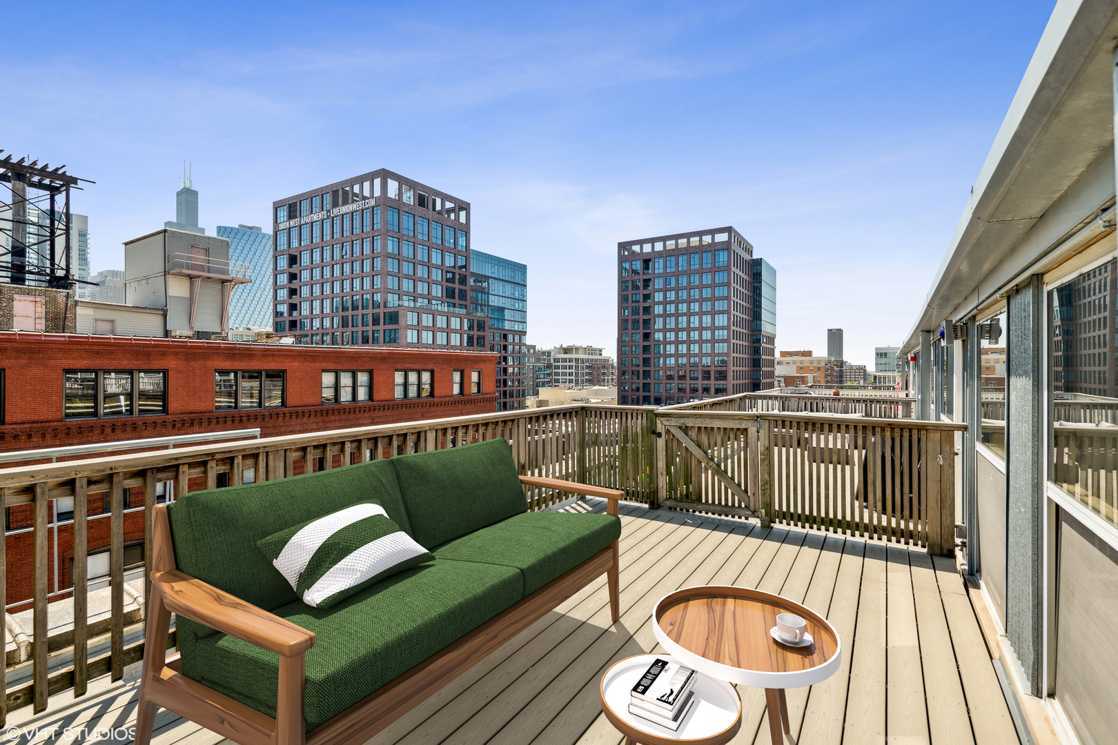1000 West Washington Boulevard, Unit 513 Chicago, IL 60607 - Photo 21 of 22 a view of a roof deck with couches and wooden floor