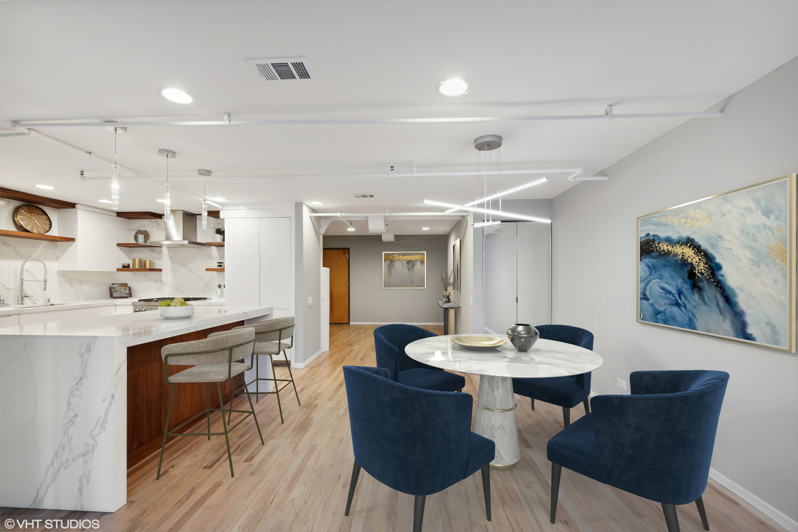 1000 West Washington Boulevard, Unit 513 Chicago, IL 60607 - Photo 3 of 22 a kitchen with a dining table chairs and white appliances