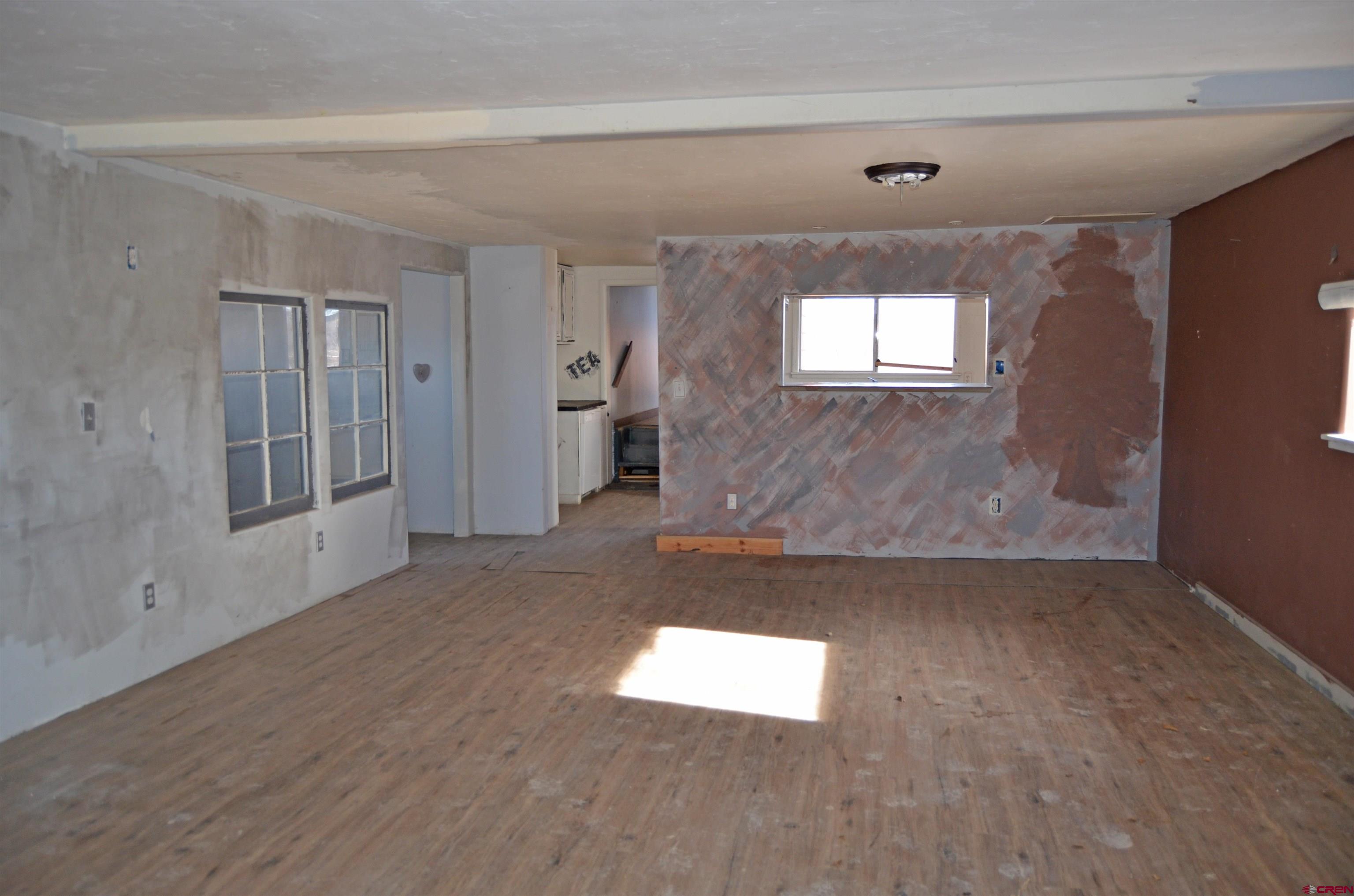 6088 Graff Road Delta, CO 81416 - Photo 4 of 16 an empty room with windows