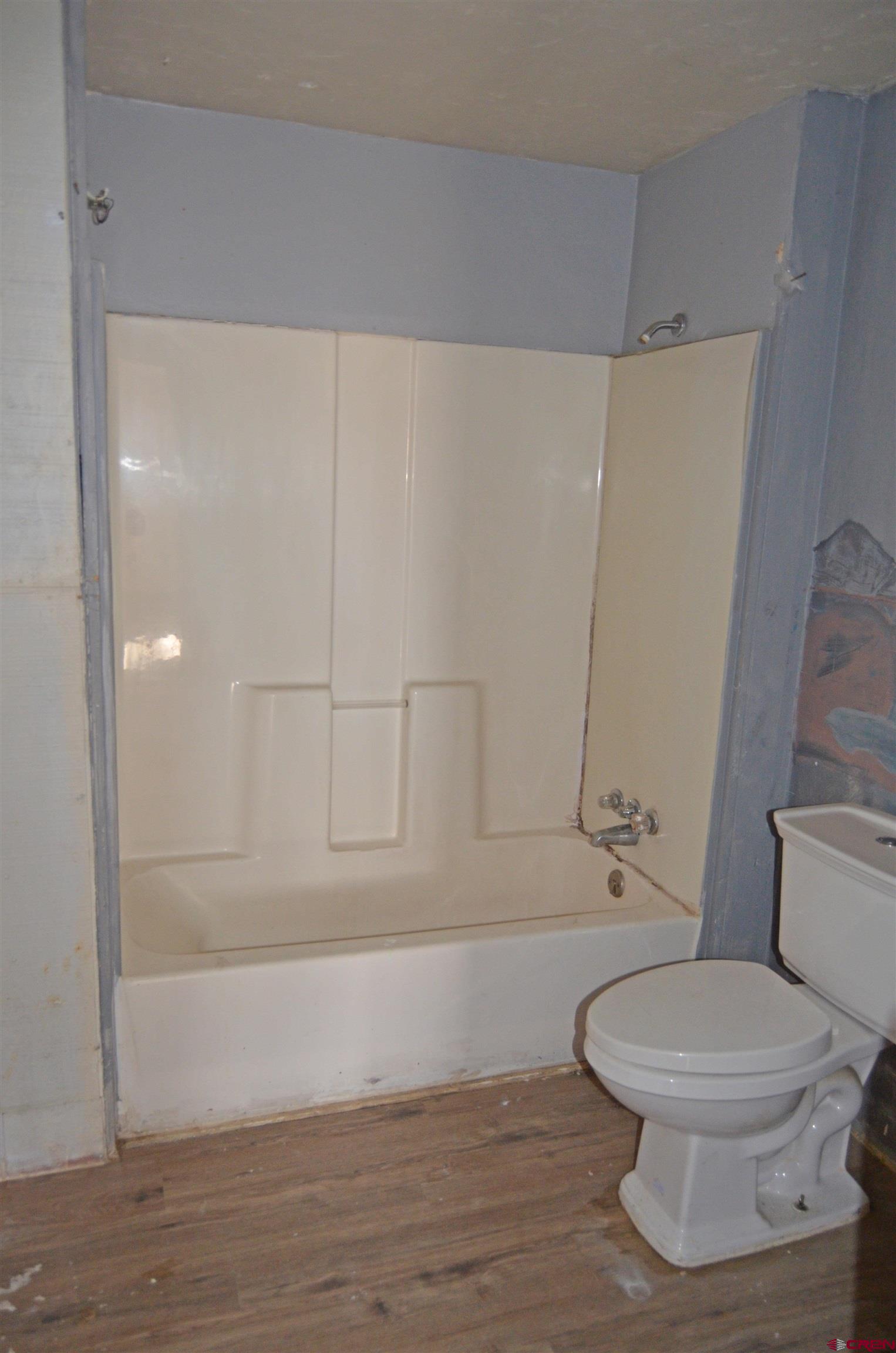 6088 Graff Road Delta, CO 81416 - Photo 5 of 16 a bathroom with a toilet and a shower
