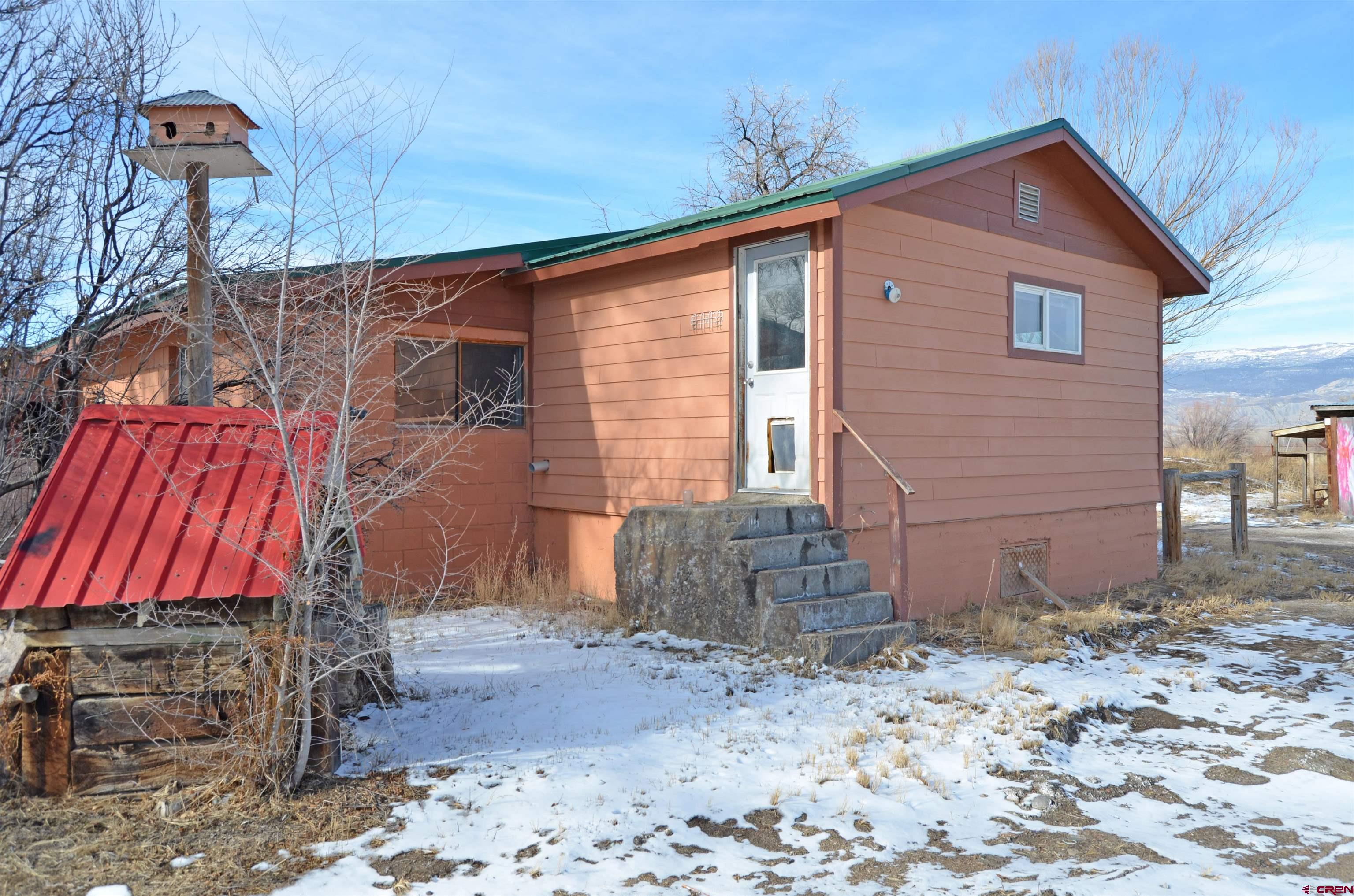 6088 Graff Road Delta, CO 81416 - Photo 9 of 16 a view of a house with a yard