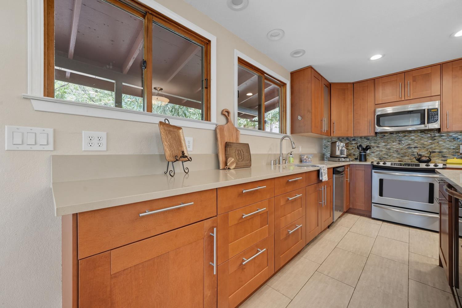 10285 Ponderosa Way Jackson, CA 95642 - Photo 21 of 84 a kitchen with stainless steel appliances granite countertop a sink and a stove