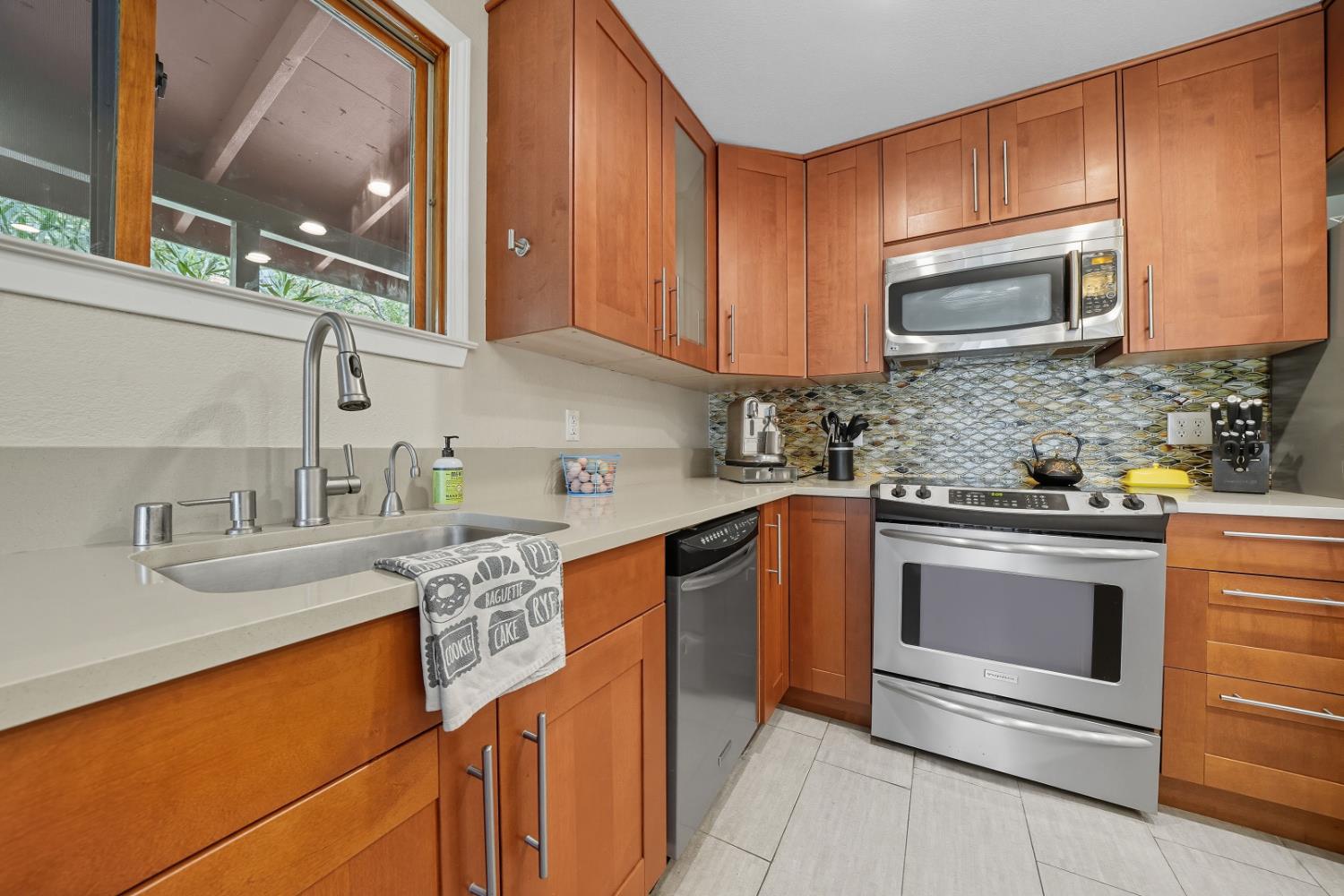 10285 Ponderosa Way Jackson, CA 95642 - Photo 22 of 84 a kitchen with stainless steel appliances granite countertop a sink stove and microwave