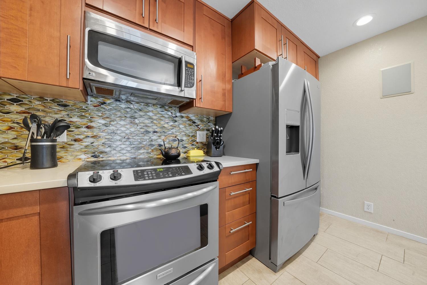 10285 Ponderosa Way Jackson, CA 95642 - Photo 23 of 84 a kitchen with stainless steel appliances granite countertop a refrigerator stove and microwave