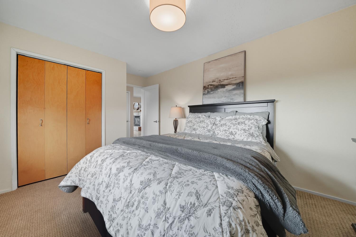 10285 Ponderosa Way Jackson, CA 95642 - Photo 42 of 84 a bedroom with a bed and a painting on the wall