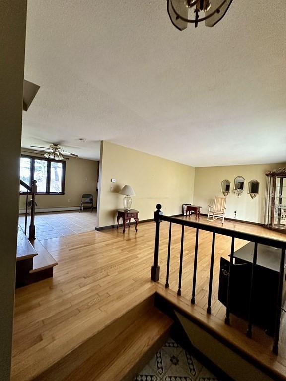 76 Americo Street Ludlow, MA 01056 - Photo 12 of 21 a view of living room with furniture and wooden floor