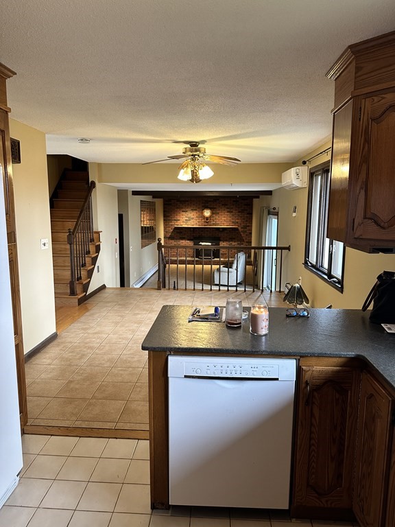 76 Americo Street Ludlow, MA 01056 - Photo 3 of 21 a kitchen with stainless steel appliances granite countertop a sink and a refrigerator