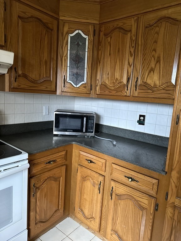 76 Americo Street Ludlow, MA 01056 - Photo 6 of 21 a kitchen with stainless steel appliances granite countertop a sink and cabinets