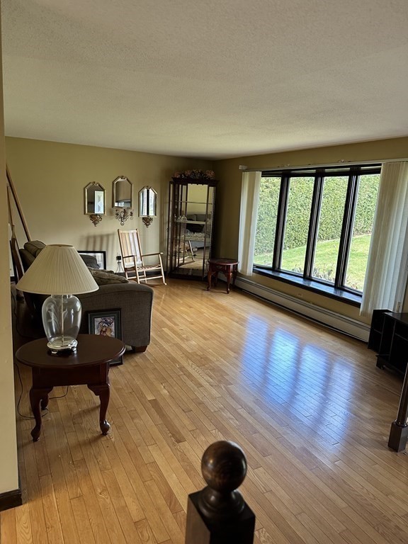 76 Americo Street Ludlow, MA 01056 - Photo 7 of 21 a living room with furniture and a large window