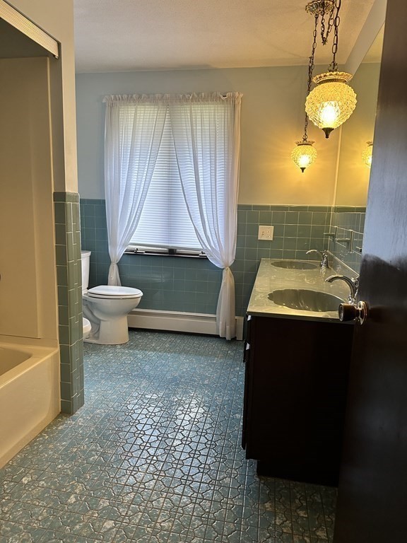 76 Americo Street Ludlow, MA 01056 - Photo 8 of 21 a bathroom with a sink toilet and shower