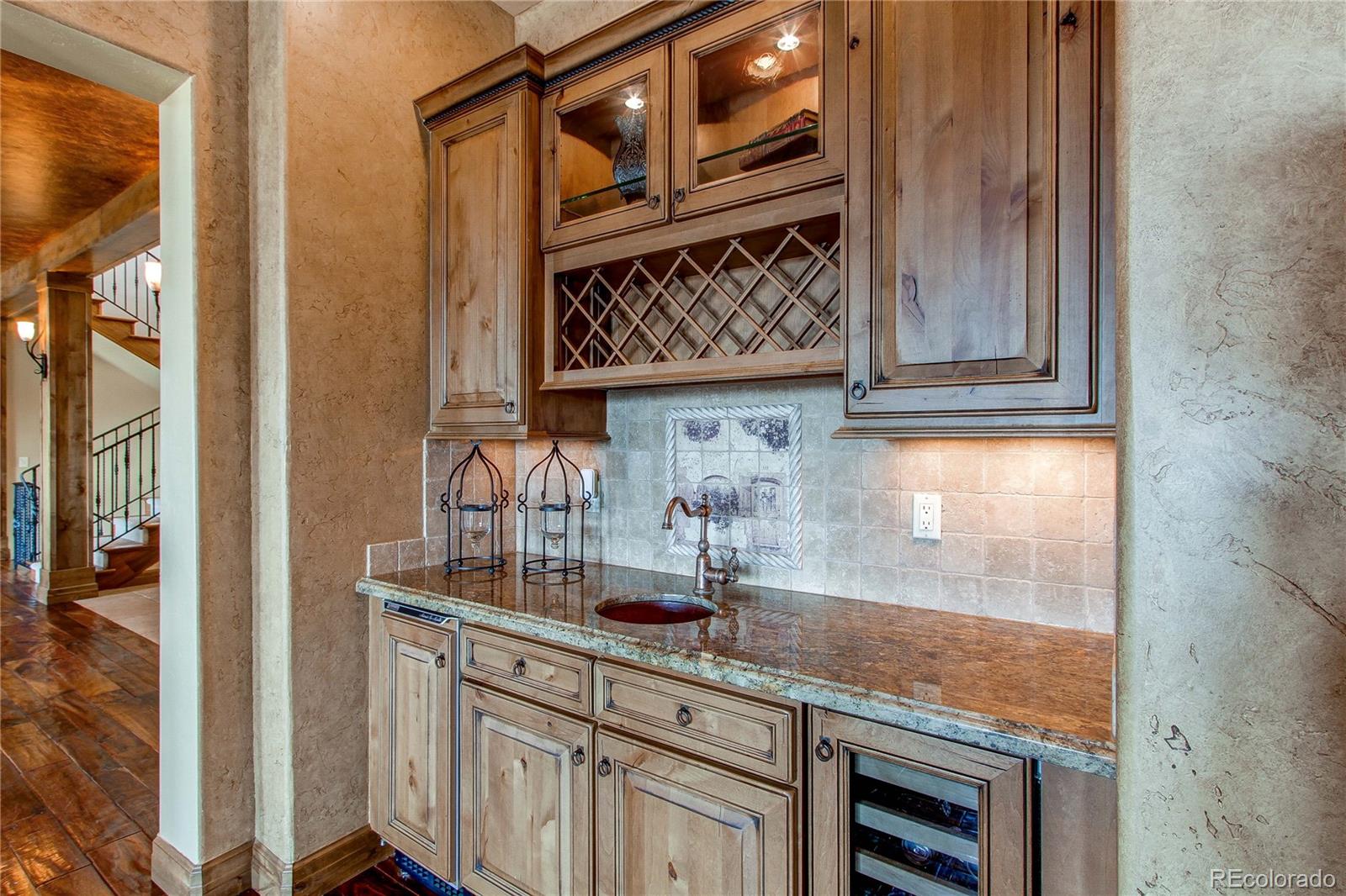 5764 Amber Ridge Drive Castle Pines, CO 80108 - Photo 12 of 50 a kitchen with a sink and cabinets