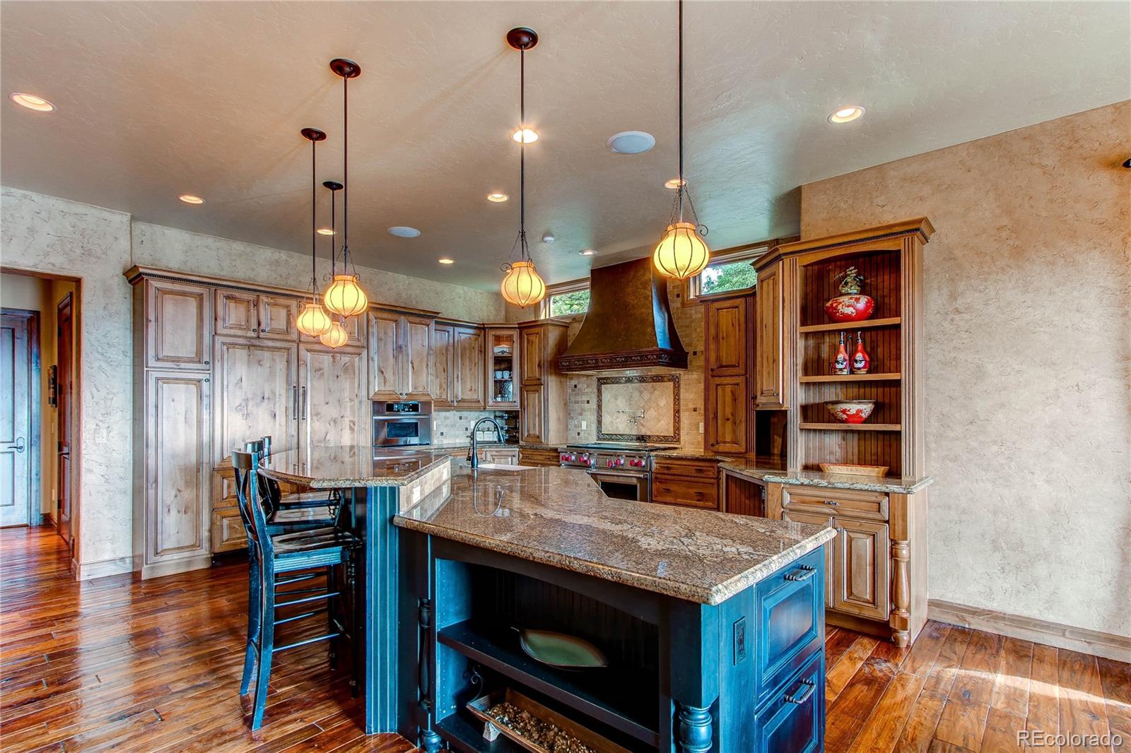 5764 Amber Ridge Drive Castle Pines, CO 80108 - Photo 16 of 50 a open kitchen view with a table and chairs