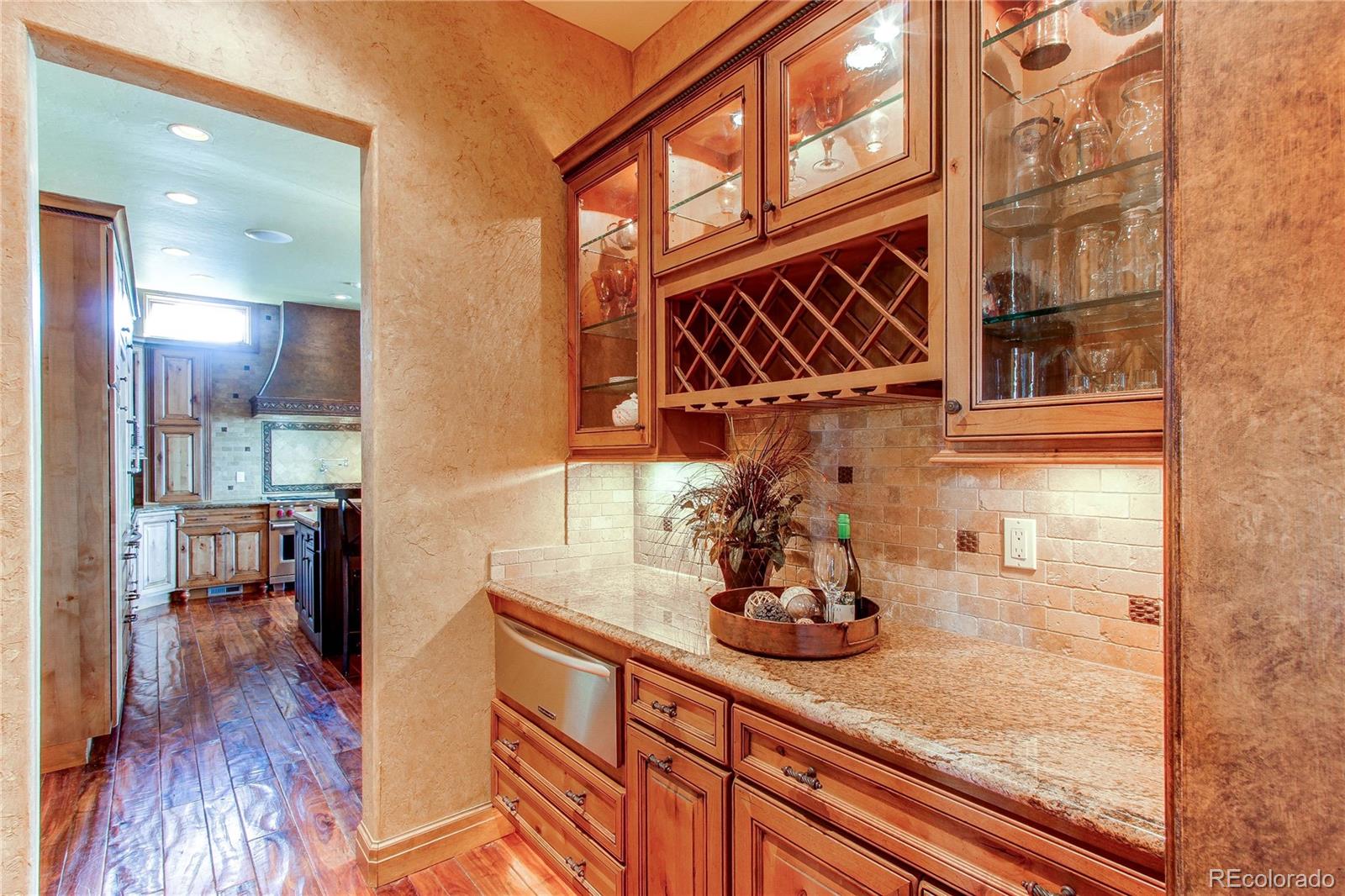 5764 Amber Ridge Drive Castle Pines, CO 80108 - Photo 18 of 50 a kitchen with sink and wooden floor