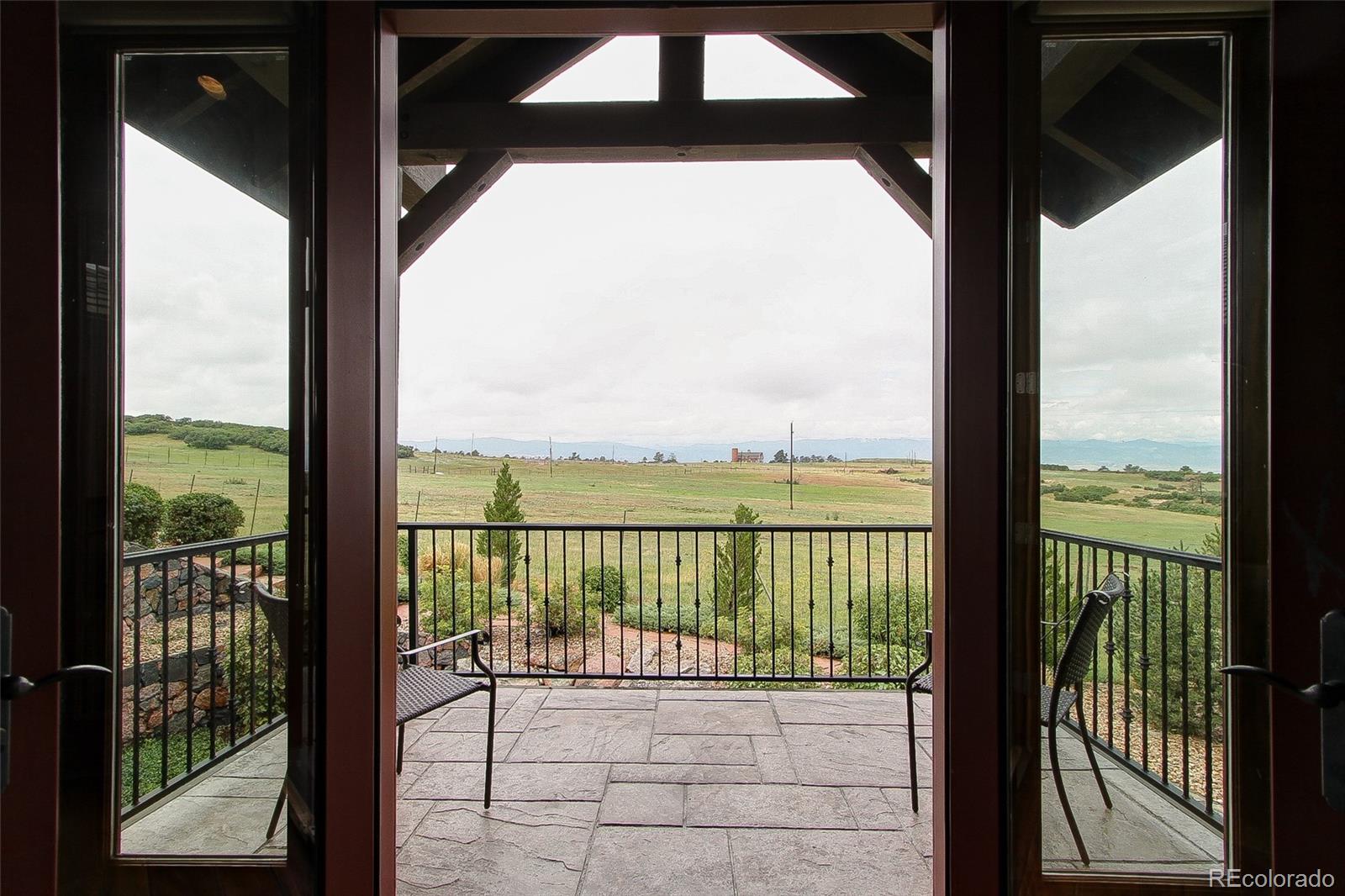 5764 Amber Ridge Drive Castle Pines, CO 80108 - Photo 21 of 50 a view of balcony with city view