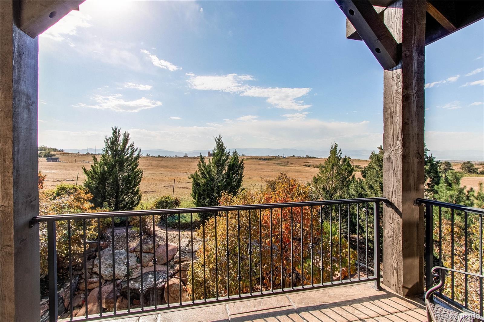5764 Amber Ridge Drive Castle Pines, CO 80108 - Photo 22 of 50 a view of city from a balcony